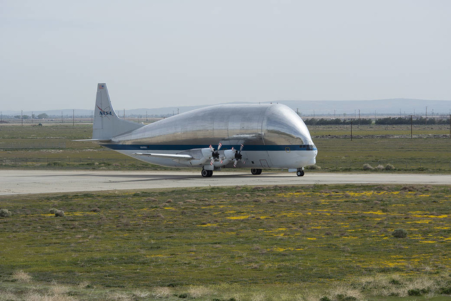 NASA’s Super Guppy cargo transport aircraft taxis in from the Plant 42 runway to NASA’s Armstrong Flight Research Center Building 703 ramp. The aircraft is being stored in the hangar during its phase maintenance check.