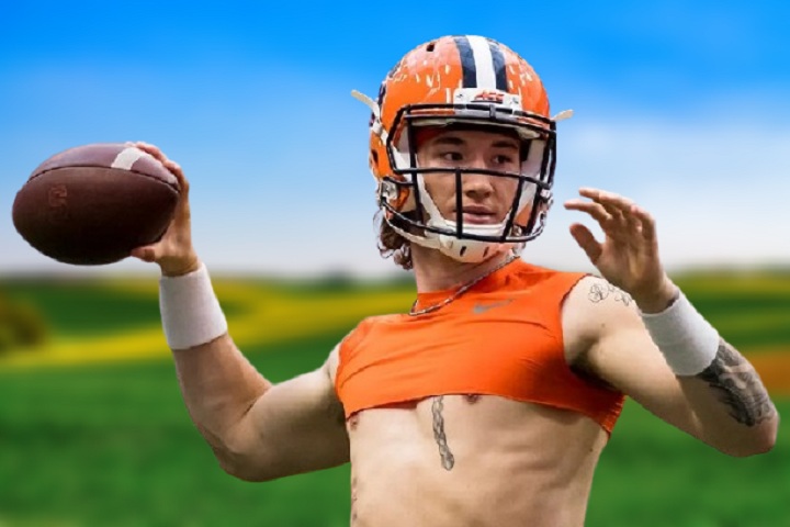 Rex Culpepper, Syracuse University quarterback, smiling on the football field in uniform