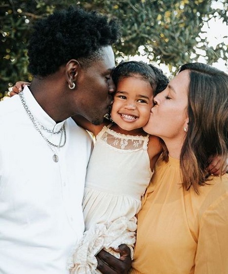 Lauren and Jrue Holiday and their daughter Jrue.